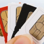 Close up shot of extra SIM card lying with other cards