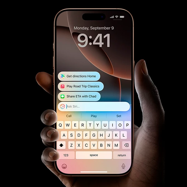 Hand holds iPhone 16 showcasing advanced texting features