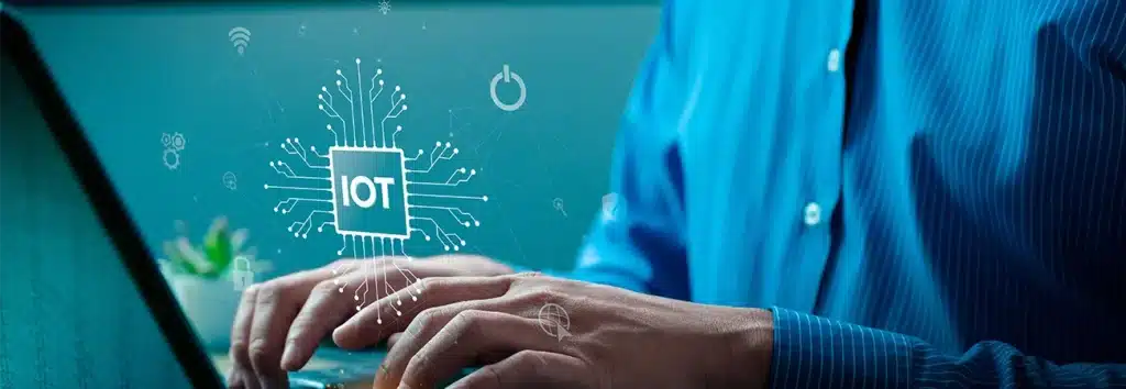 Man uses work laptop with IoT integrations 