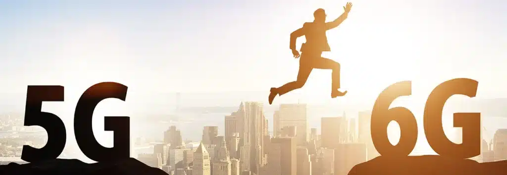 Suited man jumps between 5G and 6G, symbolising the switch from 5G to 6G network in future