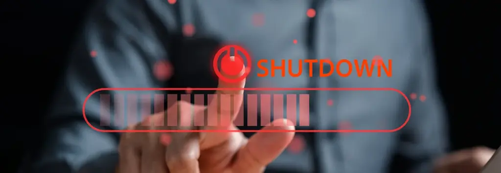 Business man points at "shutdown" button symbolising network shut-down